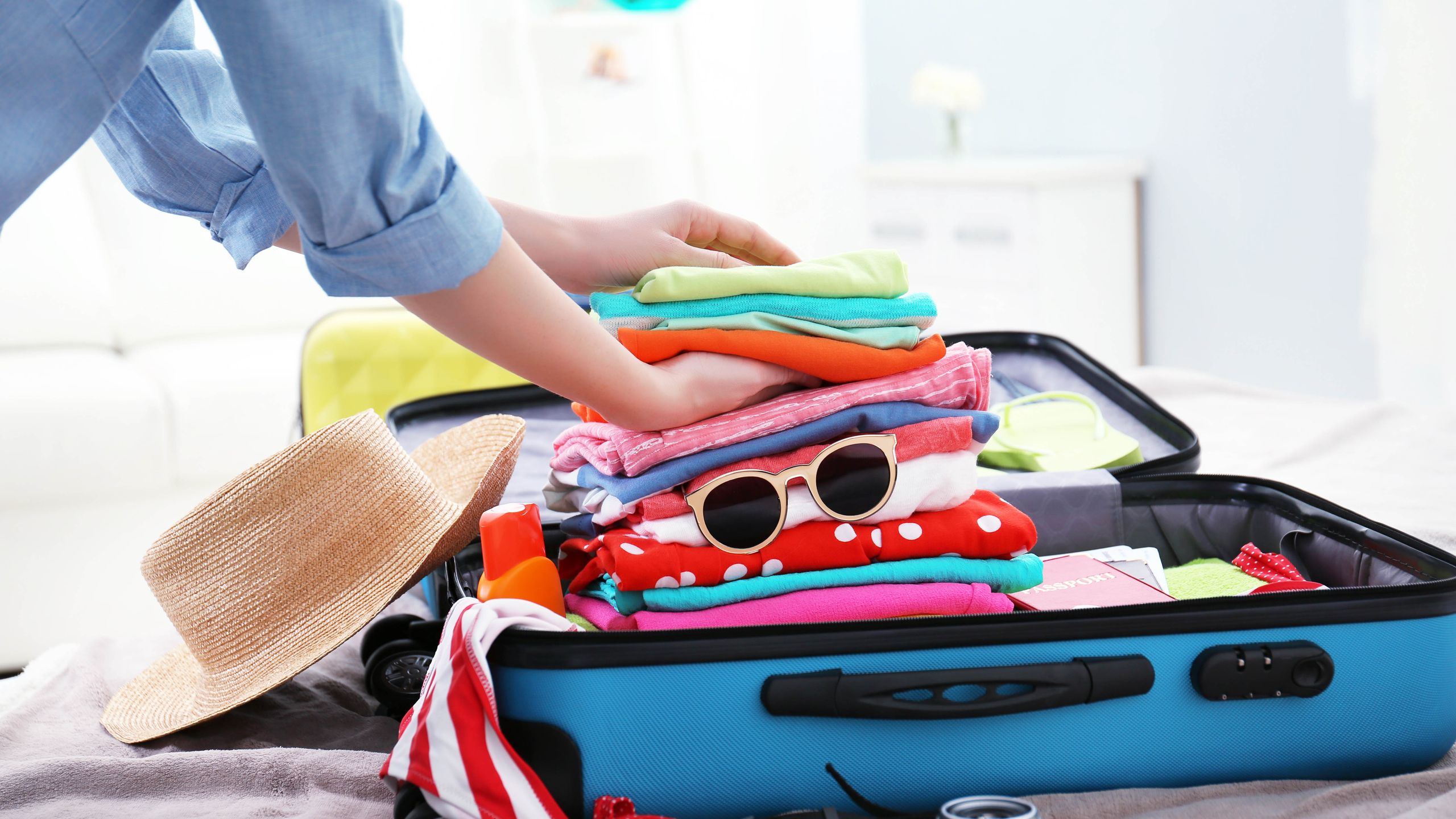 An open suitcase packed for a trip to Turkey